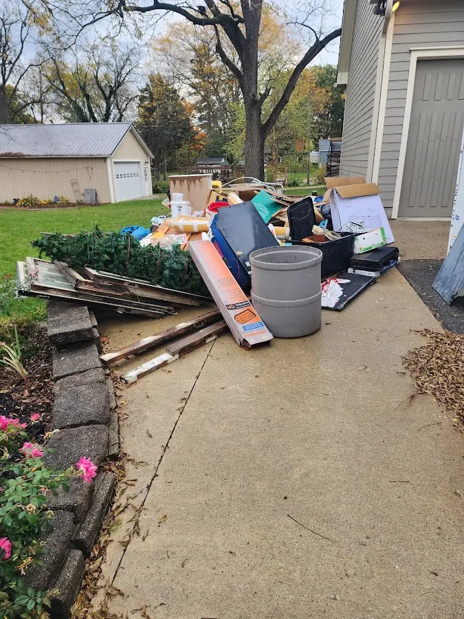 Dumpster being loaded with debris for Demolition Dumpster Rental in Pleasant Hills